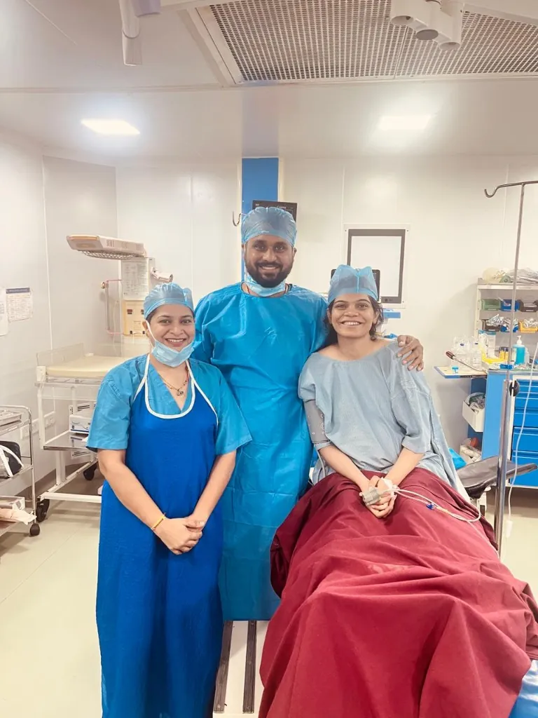 Dr. Poonam with parents in the sterile operation theater/surgical room